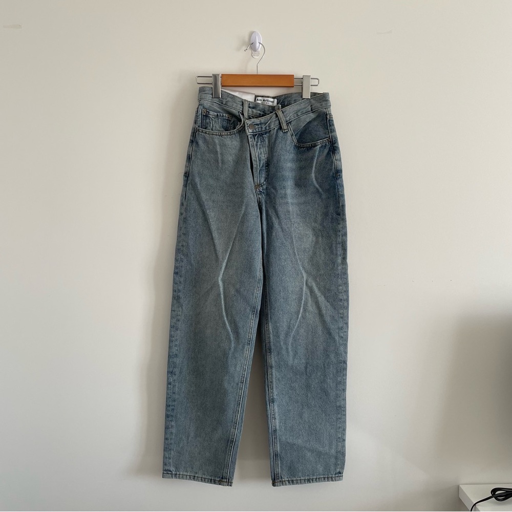 Criss cross baggy blue jeans